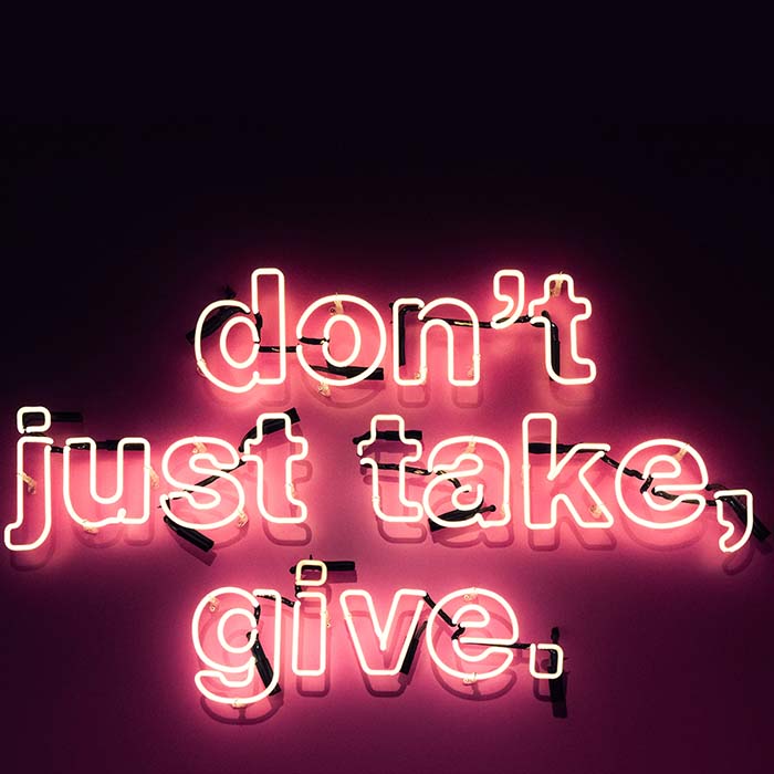 neon sign: don't just take, give